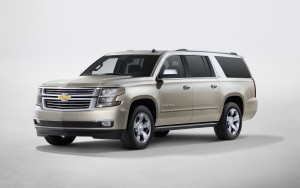 2015 Chevrolet Suburban in Champagne side view from New York rev