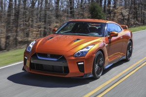 The 2017 GT-R's exterior receives a thorough makeover. The new V-motion grille, one of Nissan's latest design signatures, has been slightly enlarged to provide better engine cooling and now features a matte chrome finish and an updated mesh pattern. A new hood, featuring pronounced character lines flowing flawlessly from the grille, has been reinforced to enhance stability during high-speed driving. A freshly designed front spoiler lip and front bumpers with finishers situated immediately below the headlamps give the new GT-R the look of a pure-bred racecar, while generating high levels of front downforce.